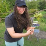 Ammaarah Sajad poses with a fish she has just caught