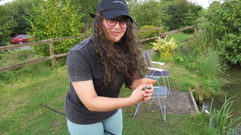 Ammaarah Sajad poses with a fish she has just caught