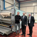 Nelson business receives grant from Nelson Town Deal. Councillor Asjad Mahmood, Leader of Pendle Borough Council with Gareth Darby, Operations Manager at Clarkson Coatings Ltd